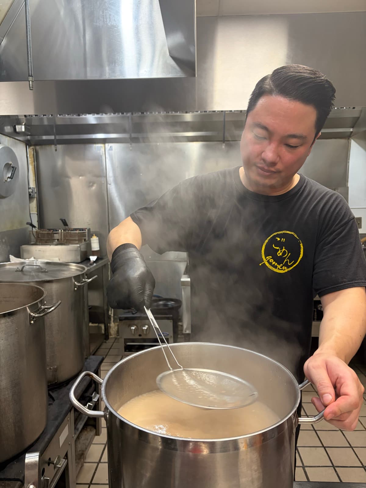 Straining pork-bone broth into a fresh pot, Gomen Ramen kitchen, Stanton